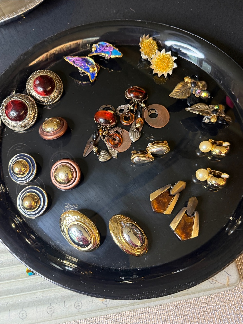 Gold and multi color clip earrings.